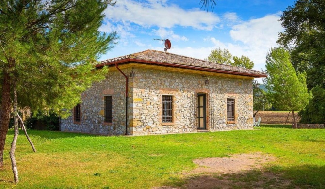 A rustic house set in the Tuscan landscape